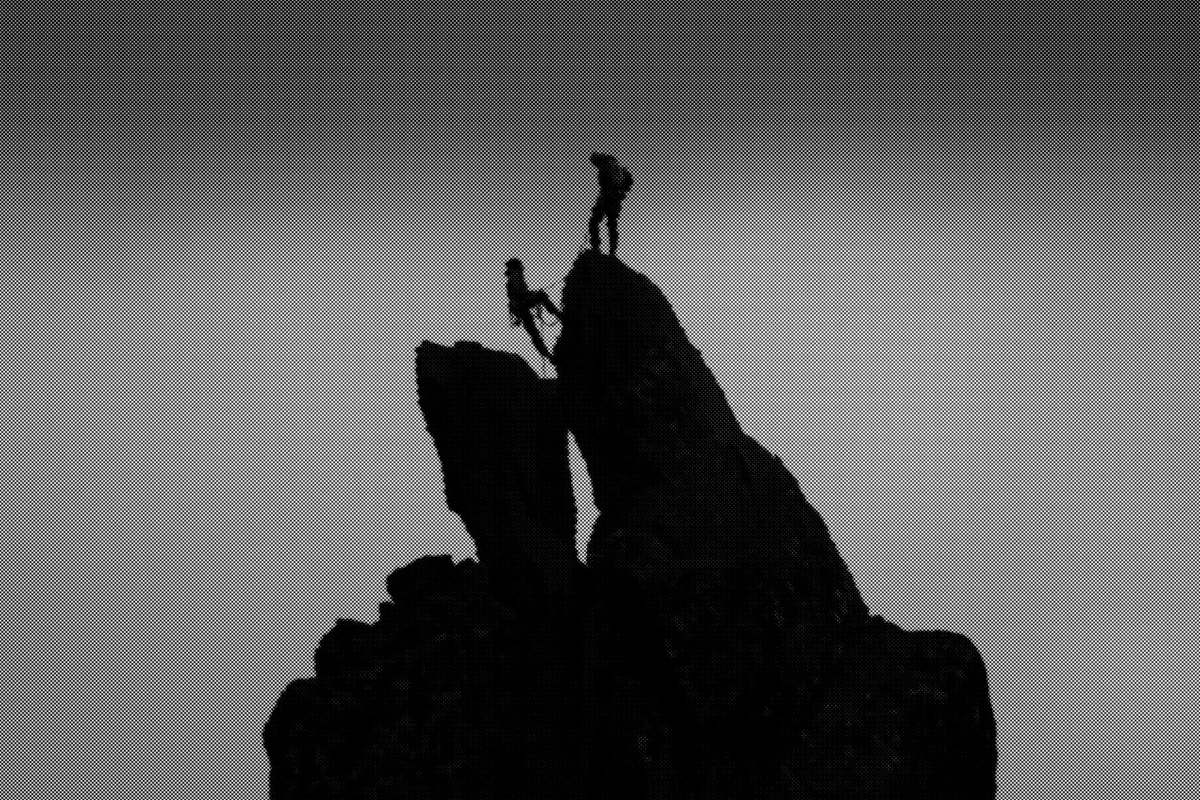 A dark, distorted, halftone image of two climbers reaching the top of a craggy mountain.